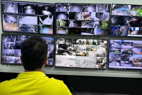 guard-watching-surveillence-camera-footage