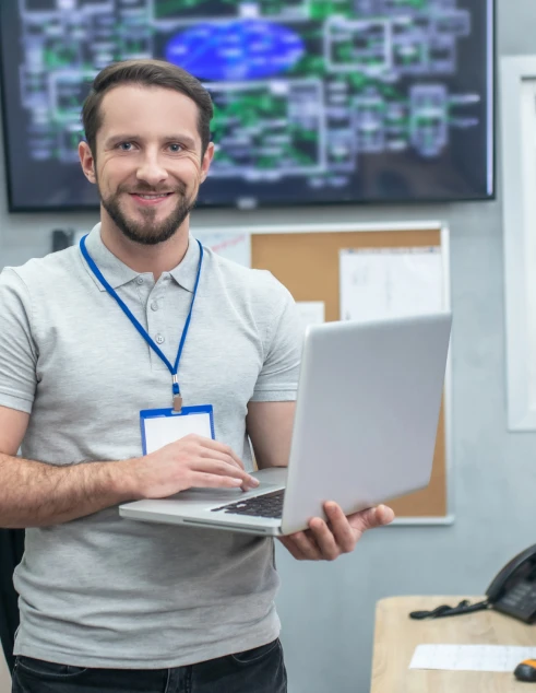 man-standing-with-laptop